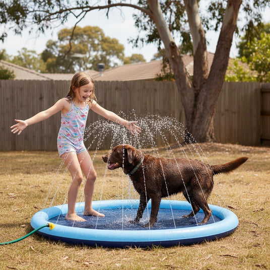 Girl and labrador on the splash pad