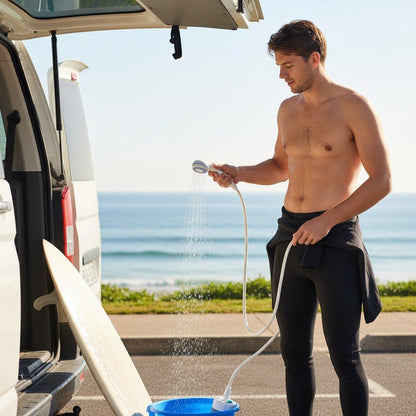 Surfer rinsing off at the van